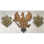 A Prussian Imperial German Infantry Officer’s Pickelhaube helmet brass plate, together with a pair