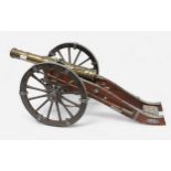 A scale model of a 19th Century French Muzzle-Loading Cannon, on two wheel carriage with loading and