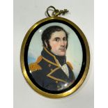 A Mid-19th century oval portrait miniature of a senior Naval officer, with black curly hair and