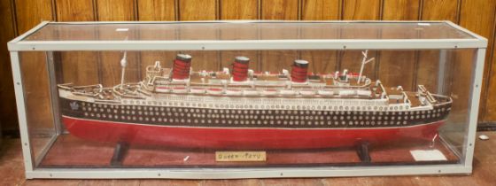 A large scratch built model of the White Star Line RMS Queen Mary, with wood effect deck,