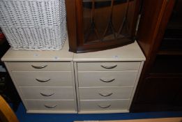 Two light wood-grain finished four-drawer bedside cabinets, 19 1/2" x 17" x 26 1/2" high.