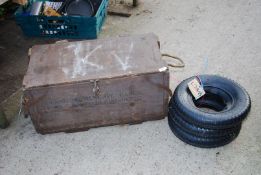 Three 3.50/8 tyres and tubes and a wooden military box.