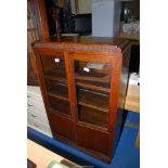 An Oak framed glazed display cabinet, 30" x 11 1/2" x 48" high.