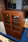 An Oak framed glazed display cabinet, 30" x 11 1/2" x 48" high.