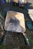 A wheelbarrow with pneumatic tyre.