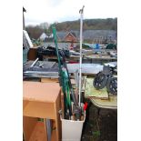 A tub of garden tools, stainless steel spade, trowels, lopper, etc.
