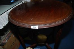 A box of prints and a circular Mahogany light-wood strung occasional table, 2' x 29" high.