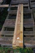Twelve lengths of tanalised timber, 2 1/4'' x 1 1/2'' x 50 1/2'' long.