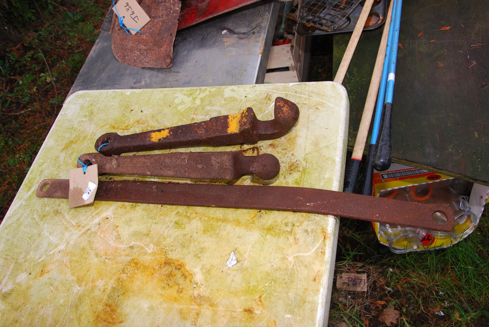 Two Massey Ferguson pick up hitch hooks and a straight stabiliser bar.