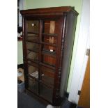 A glass fronted dark Oak bookshelves, 34" x 13" x 62 1/2" high.