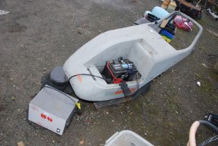 A C.S. 50bt pedestrian sweeper with charger unit.