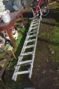 An extending 10 rung roofing ladder.