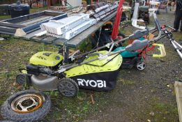 A self propelled Ryobi mower with grass box.