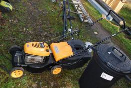 A Maculloch M40/450C mower, two stroke petrol engine, with grass box.