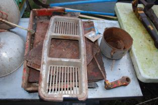 International cab parts, Ferguson guard and air cleaner oil bath and an International front grill.