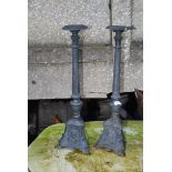 A pair of tall pricket stands.