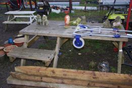 A large picnic table with room for a wheelchair.