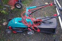 A Bosch electric mower with grass box.