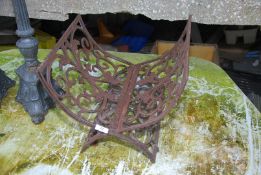 A cast iron log basket, 40cm x 40cm x 32cm high.