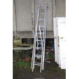 An aluminium 9 rung triple extension roofing ladder.