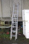 An aluminium 9 rung triple extension roofing ladder.