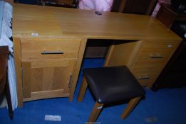 A contemporary solid light double pedestal Oak kneehole writing desk/dressing table with an