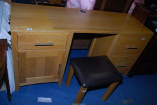 A contemporary solid light double pedestal Oak kneehole writing desk/dressing table with an