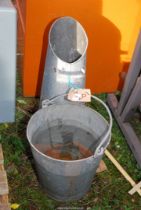 A coal scuttle and galvanised bucket.