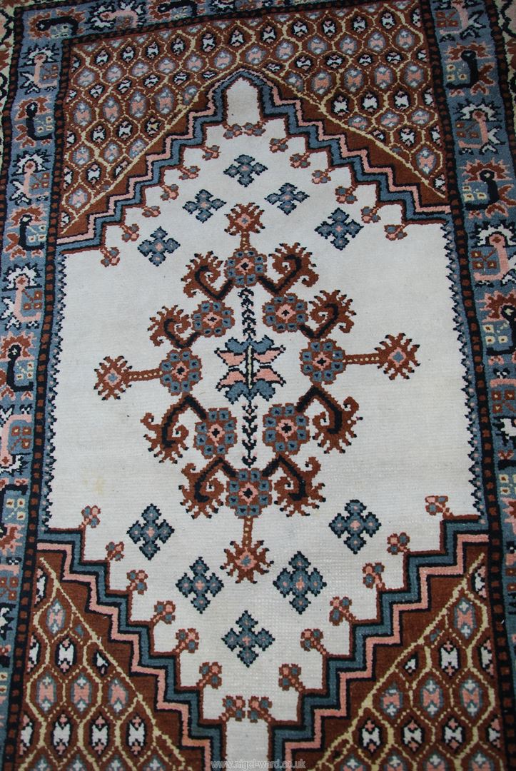 A bordered pattern and fringed rug in cream,blue brown and pink .42" wide x 72" long. - Image 2 of 2