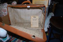 A vintage suitcase and a British Rail magazine.