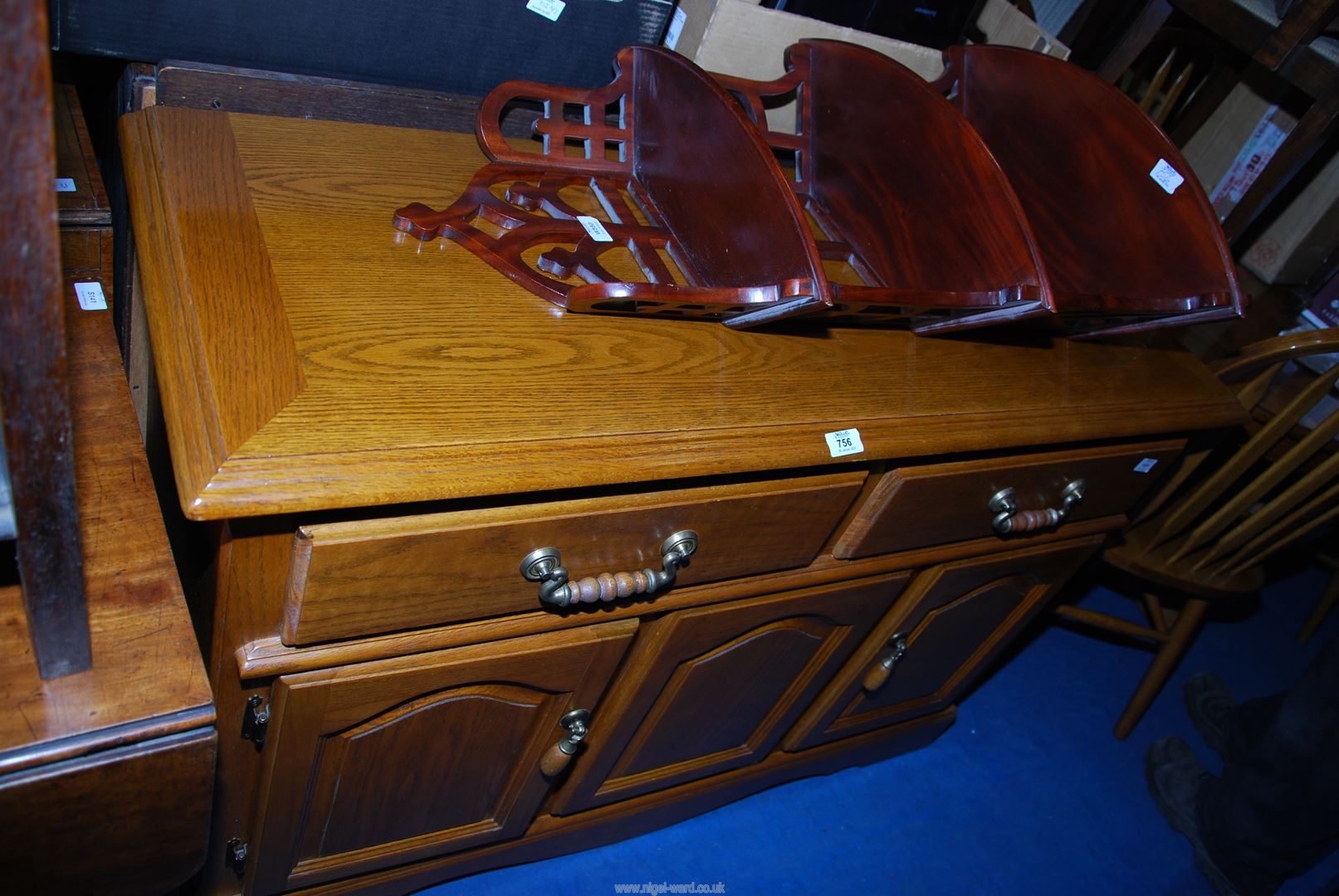 An Oak framed sideboard with two drawers and two lower cupboards,