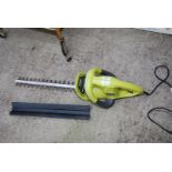 A Ryobi electric hedge sweeper.