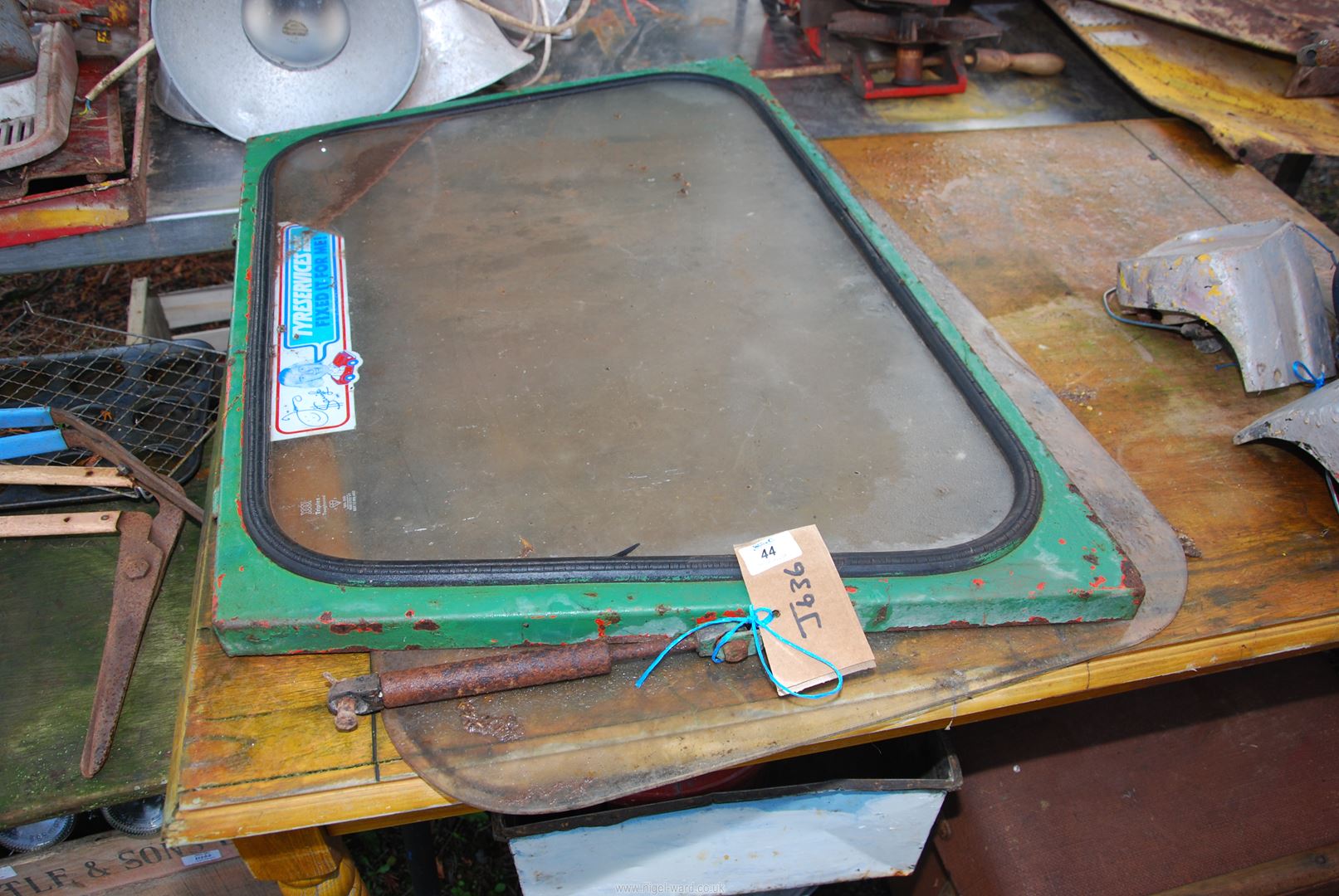 An Alexander & Duncan rear glass door for a tractor cab.