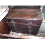 A chest of two over three drawers