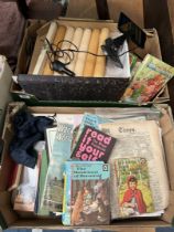 Two boxes if miscellaneous including Garmin Sat Nav, Beatrix Potter and Enid Blyton books, candles,