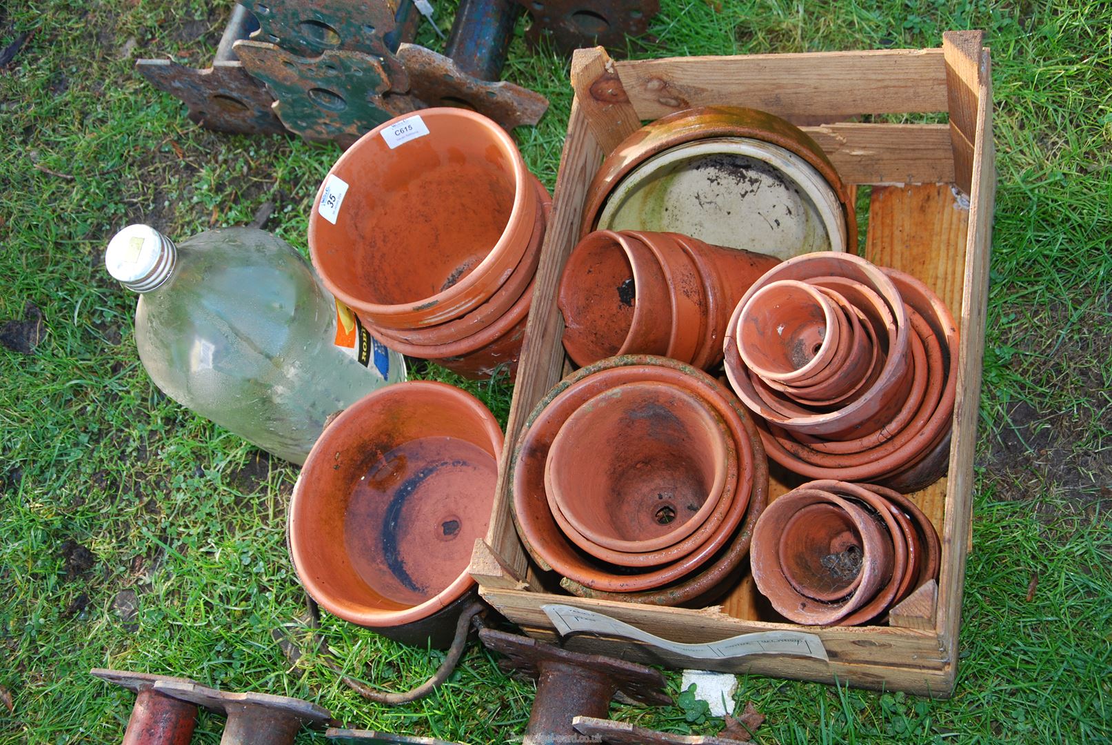 A quantity of clay pots in various sizes.