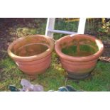 Two clay flower pots, 14" diameter x 10" high.