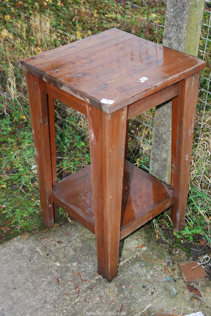 A square table with lower shelf, 18 1/2 x 31" high.