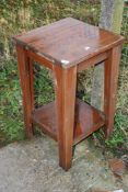 A square table with lower shelf, 18 1/2 x 31" high.