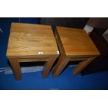 Two heavy square light-coloured Oak tables standing on square legs, 20" square x 25 1/2" high.