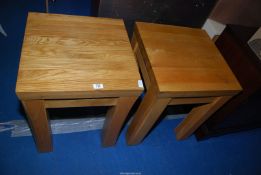 Two heavy square light-coloured Oak tables standing on square legs, 20" square x 25 1/2" high.