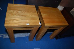 Two heavy square light-coloured Oak tables standing on square legs, 20" square x 25 1/2" high.