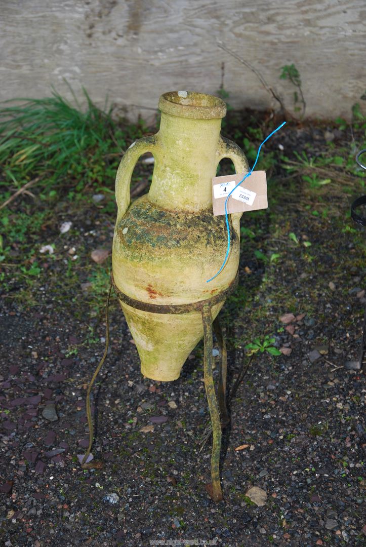 A concrete urn (27" high) on a metal stand.