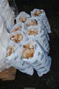 Eight small bags of softwood offcuts.