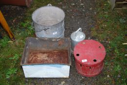 A large galvanised bucket, poultry drinker, etc.
