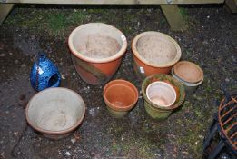 A quantity of mixed glazed flower pots.