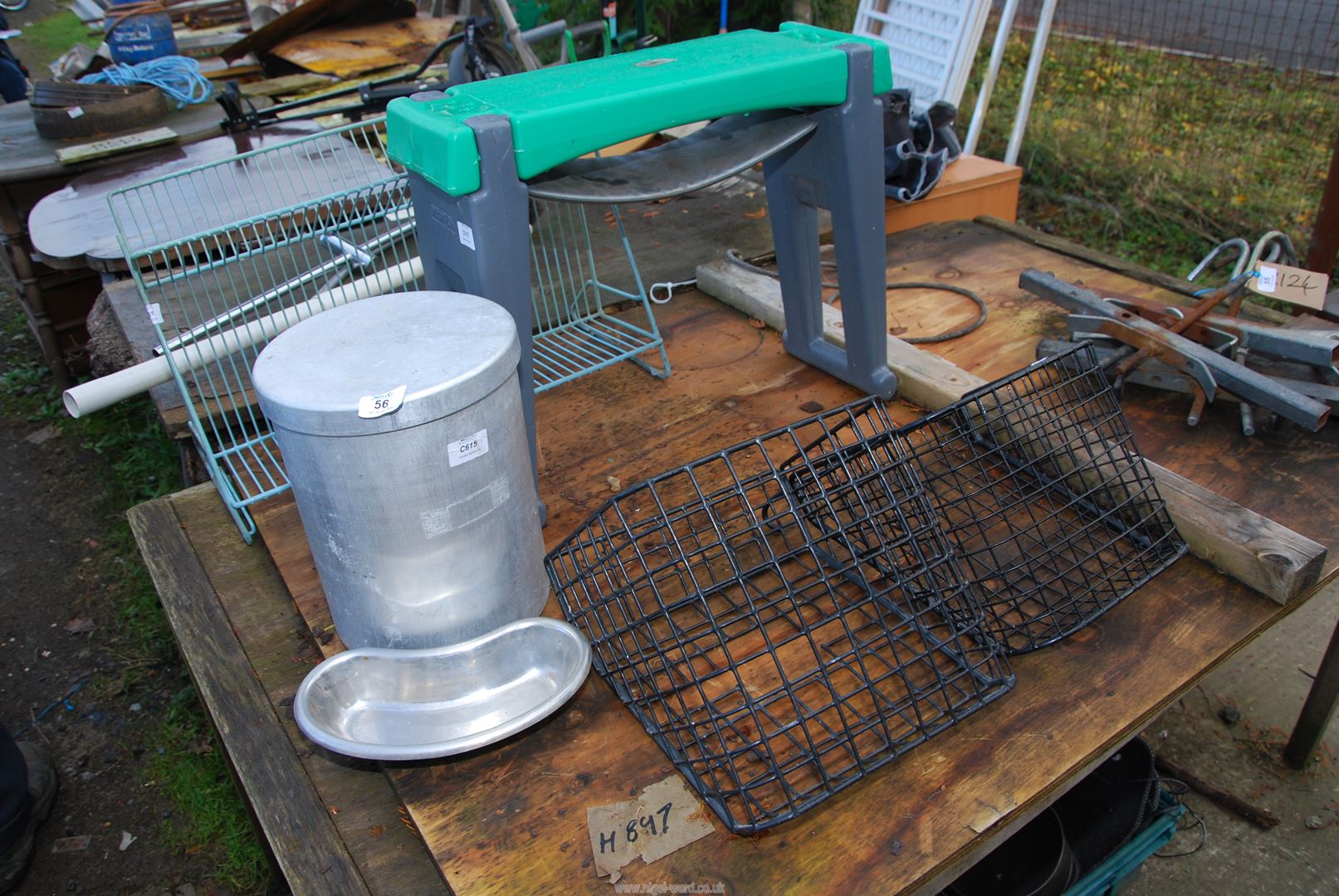 A garden kneeler, metal baskets, plate rack and aluminium canister.