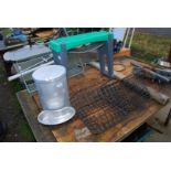 A garden kneeler, metal baskets, plate rack and aluminium canister.