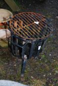 A brazier/barbecue basket and griddle.