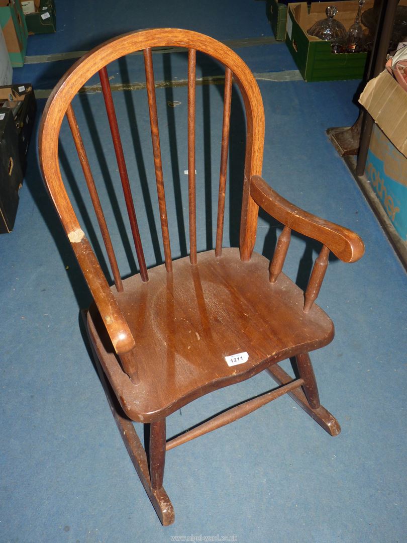 A child's Rocking Chair, 28'' high, seat height 11 1/2'', (some damage to arm joint).